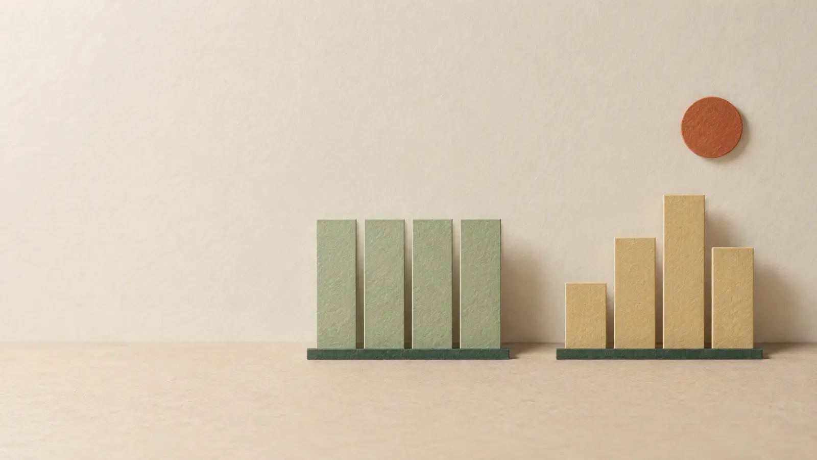 Two paper bar charts side by side, one with even bars and one with uneven bars.
